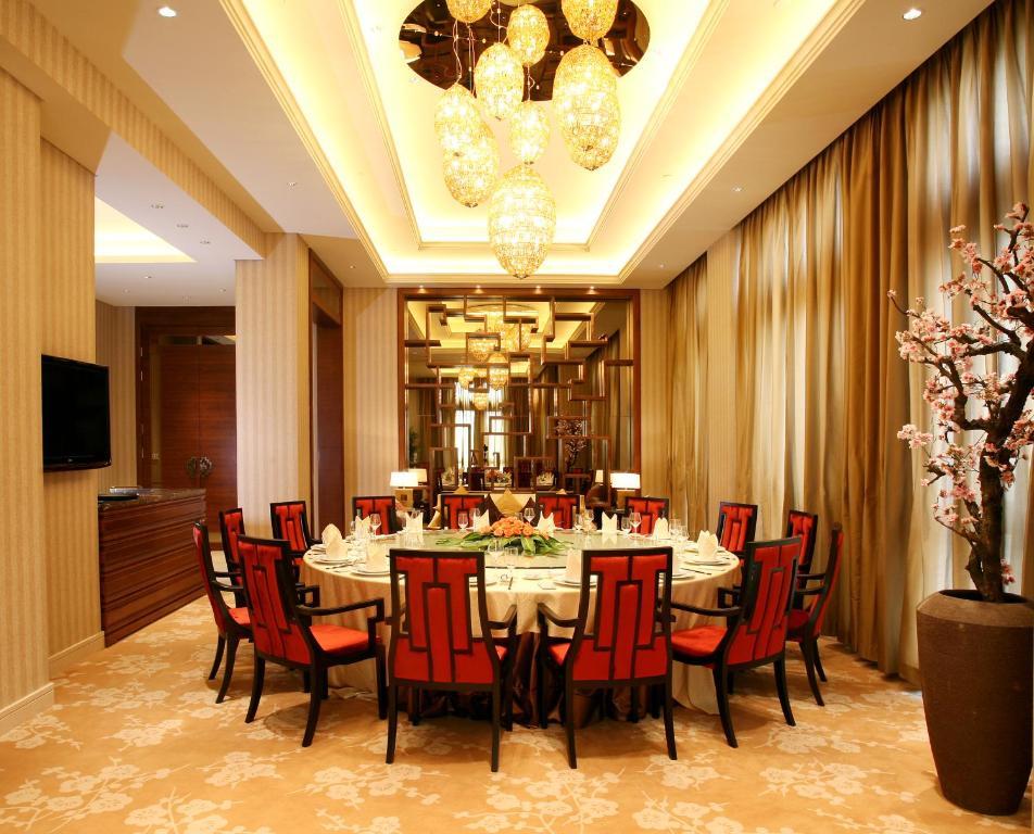 Landison Green Town Hotel Xinchang Bagian luar foto